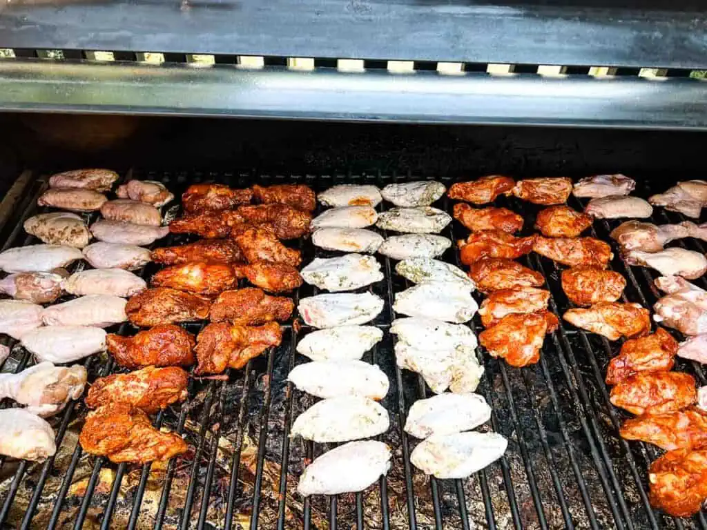 Chicken wings on a grill.