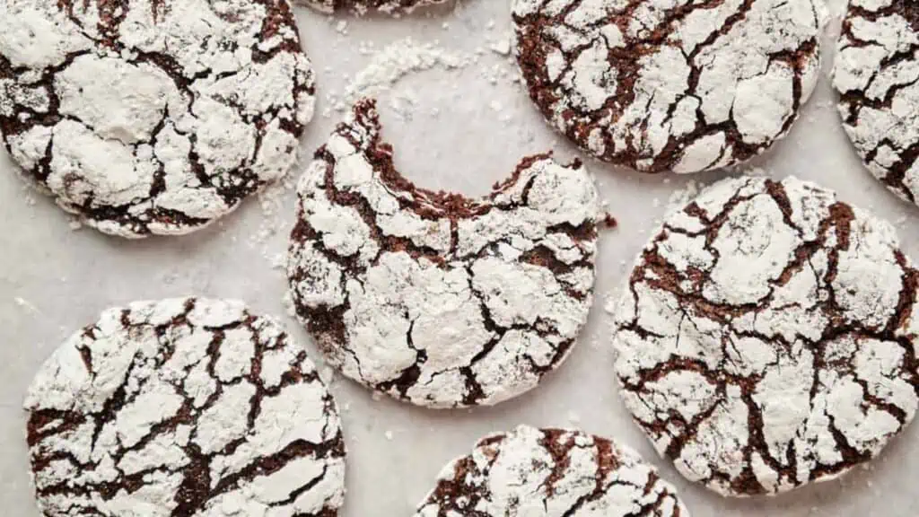 Chocolate crinkle cookies covered in powdered sugar.