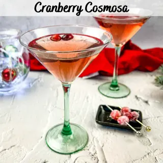 Two martini glasses filled with cranberry cosmosas.