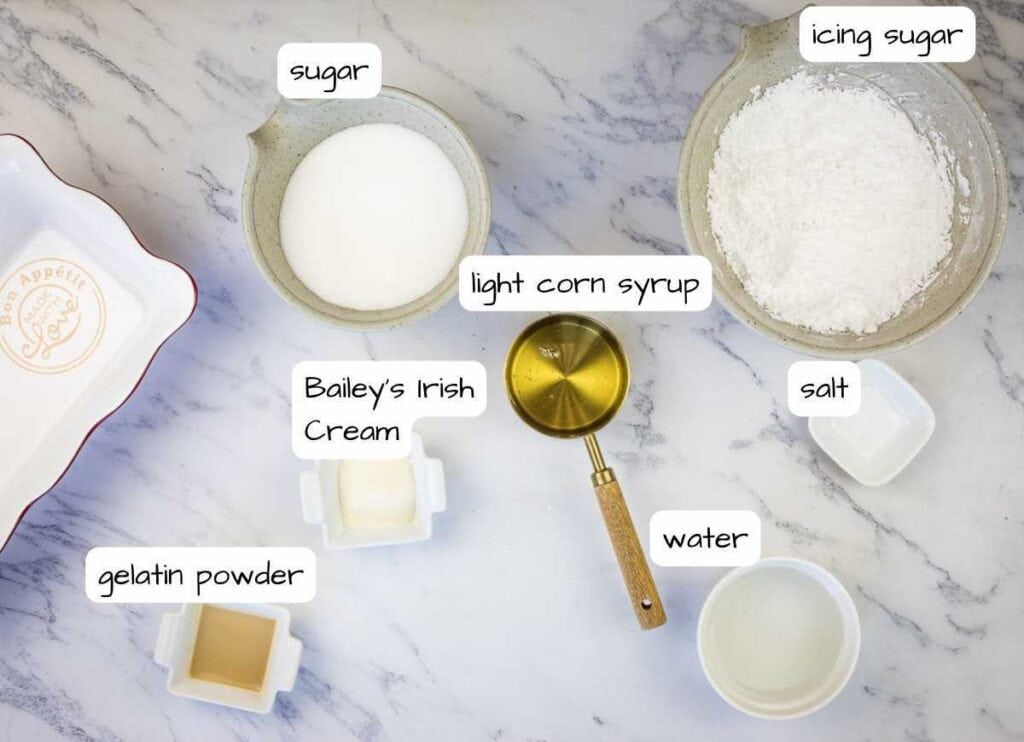 The ingredients for a cake are shown on a marble table.