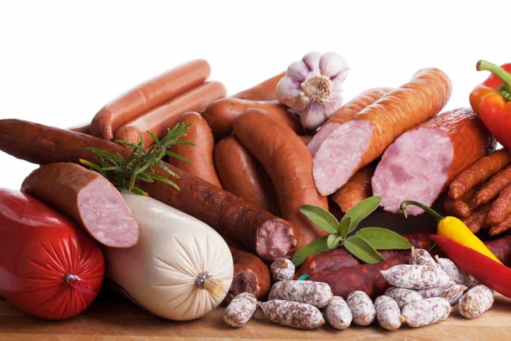 Sausages on a wooden table.