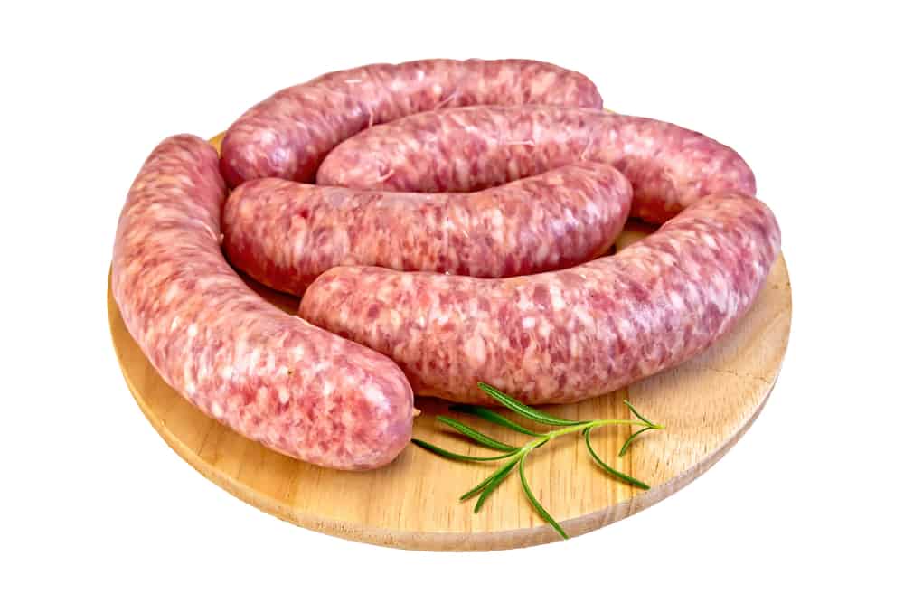 Sausages on a wooden cutting board.