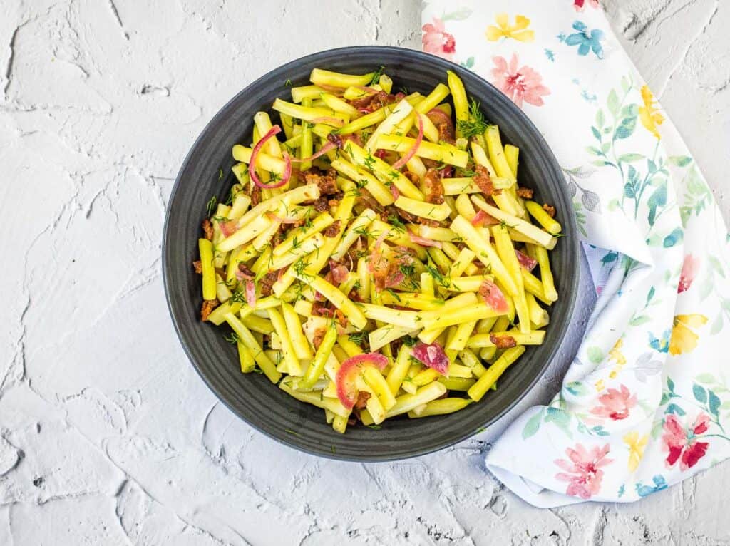 A bowl of German Yellow Beans with bacon and onions.