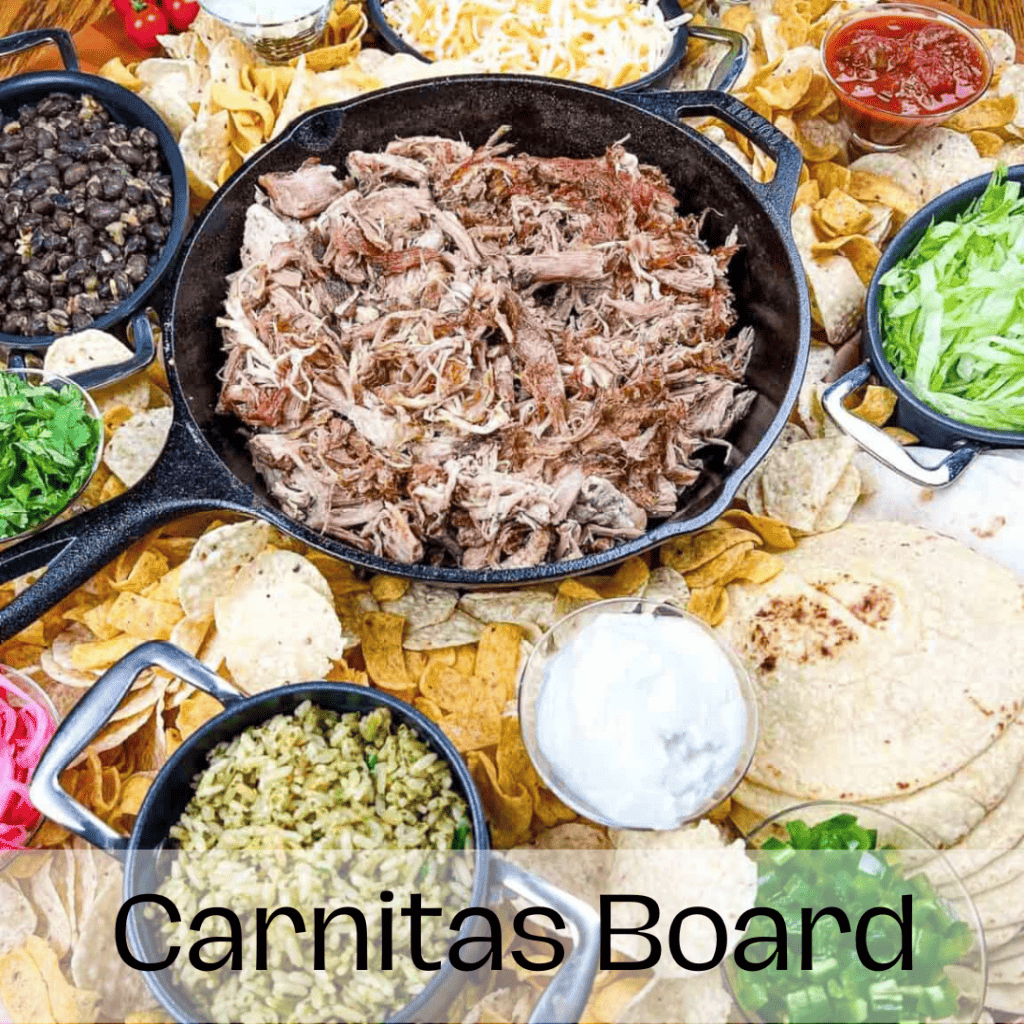 Carnitas board on a wooden table.