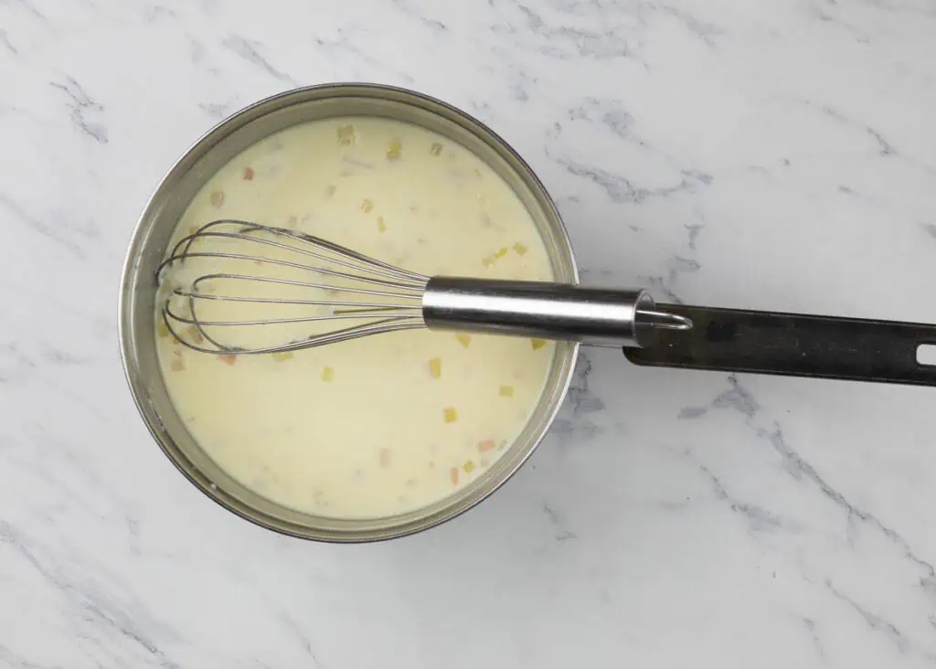 Milk added to flour mixture.