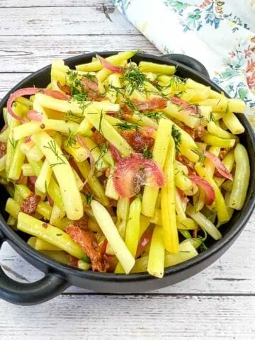 A bowl of German Yellow Beans with bacon and dill.