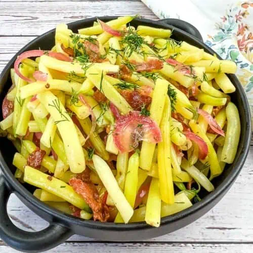 A bowl of German Yellow Beans with bacon and dill.