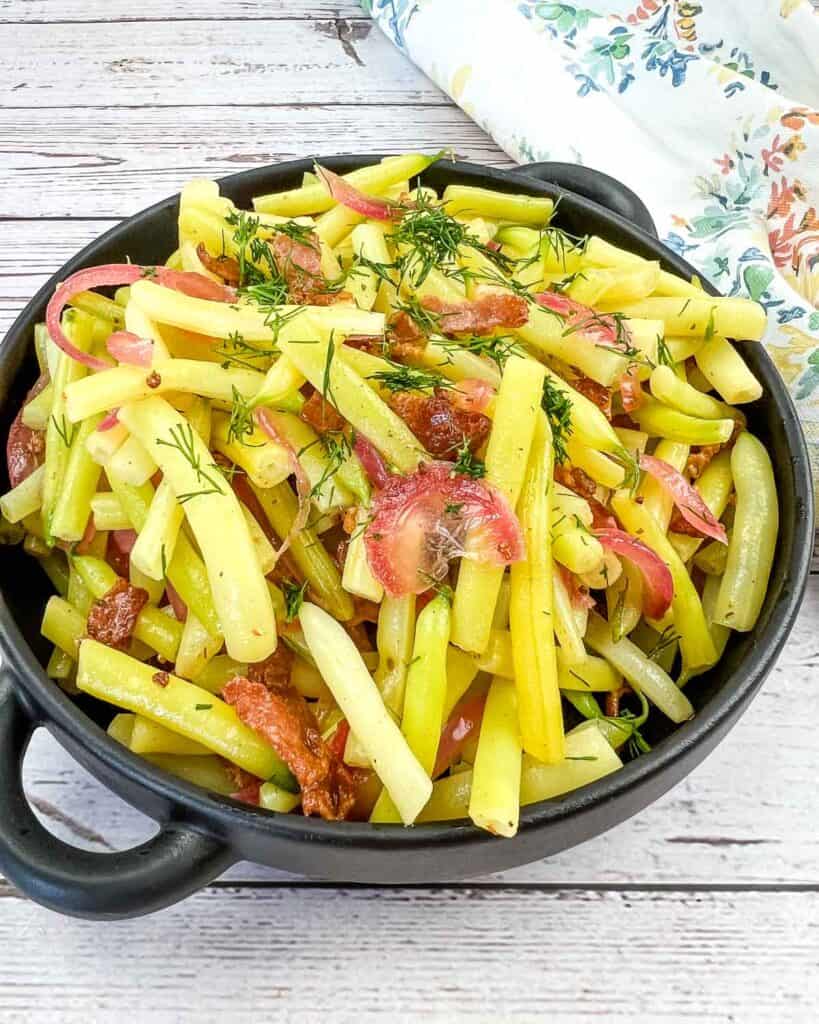 A bowl of German Yellow Beans with bacon and dill.