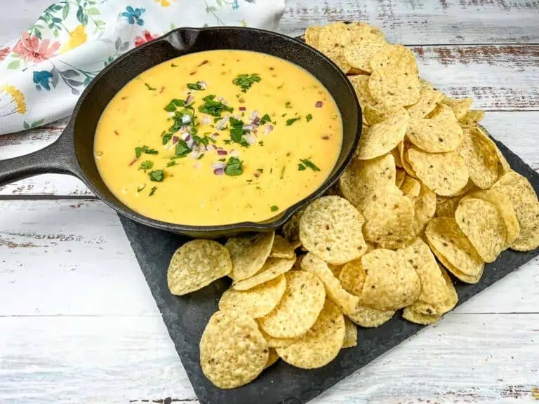 Deluxe Velveeta Queso in a skillet with chips.