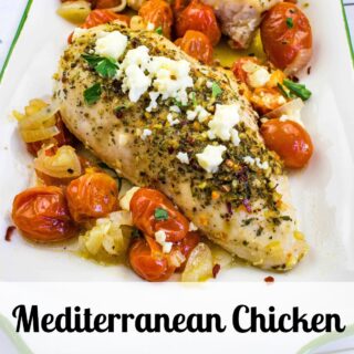 Mediterranean chicken on a plate with tomatoes and feta cheese.