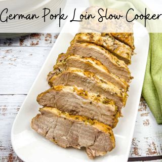 Sliced pork on a white plate with the text german pop lin slow cooker.