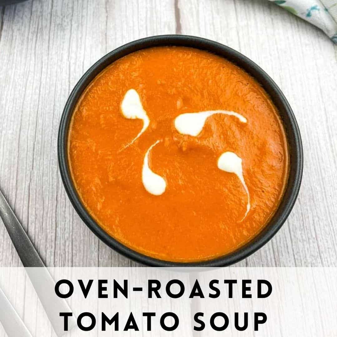 Oven roasted tomato soup in a bowl with a spoon.