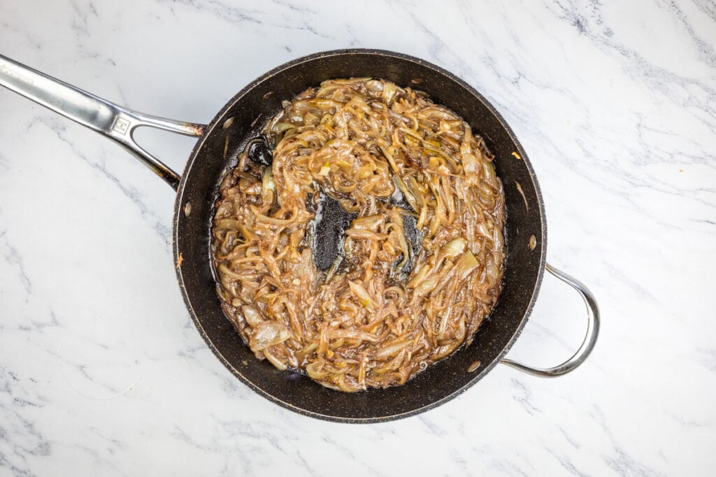 A frying pan with caramelized onions.