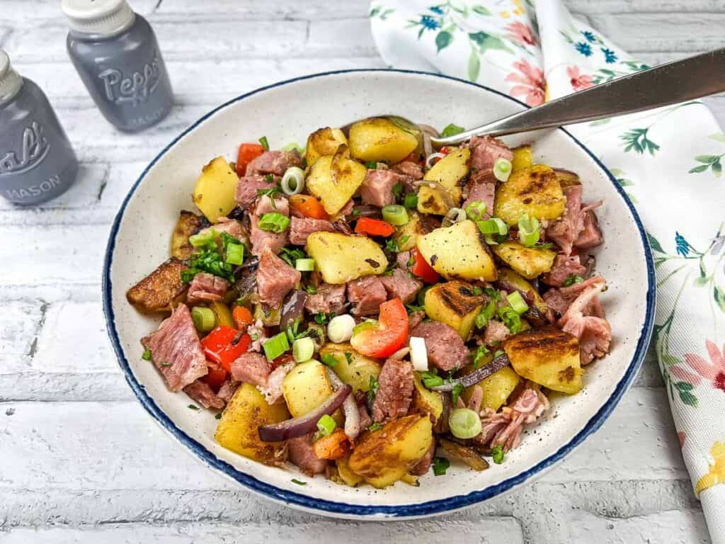 A bowl full of leftover cottage roll hash.