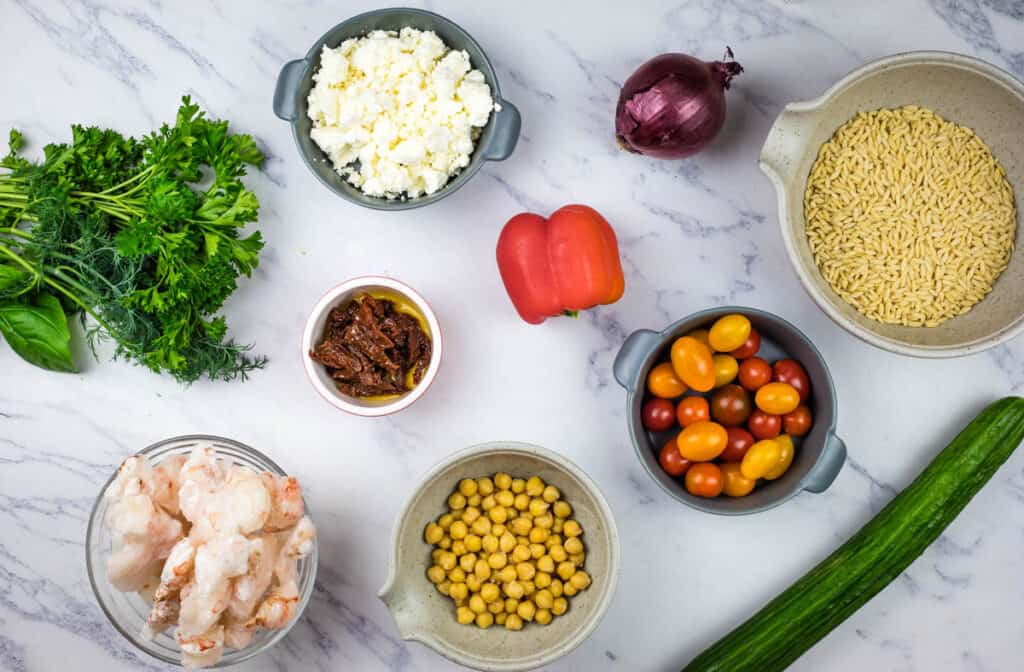 The ingredients for Mediterranean Orzo Salad with Shrimp.