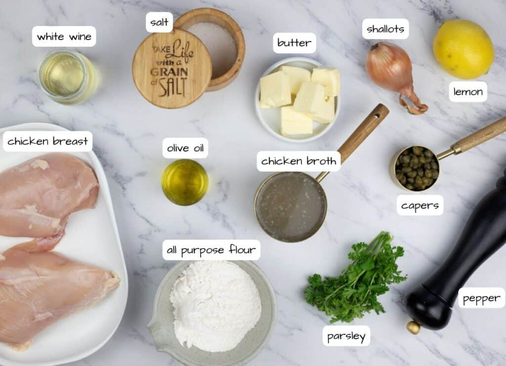 Chicken breast ingredients on a marble table.