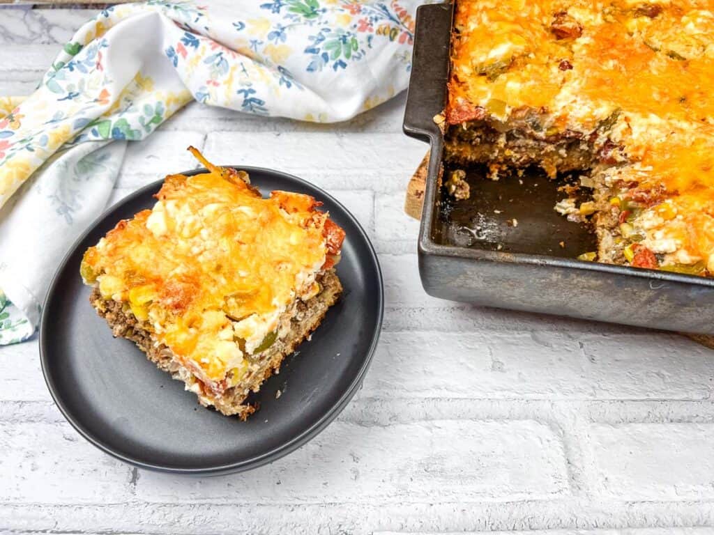 A piece of a casserole on a plate.
