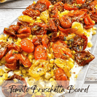 Assorted roasted tomatoes on a bruschetta board.