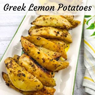 Greek lemon potatoes on a white plate.