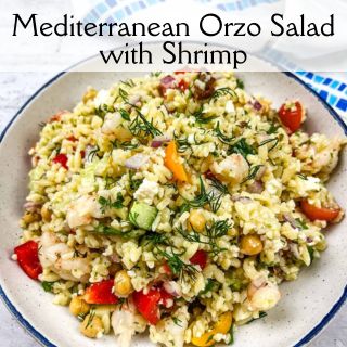Mediterranean orzo salad with shrimp in a bowl.