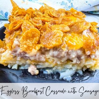 Eggs breakfast casserole with sausage on a black plate.