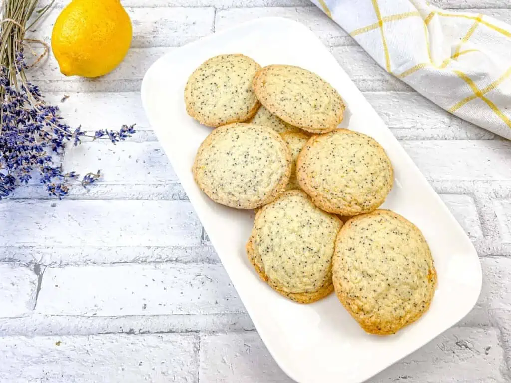 A top-down shot of Lemon Poppy Seed Cookies on a white plate.