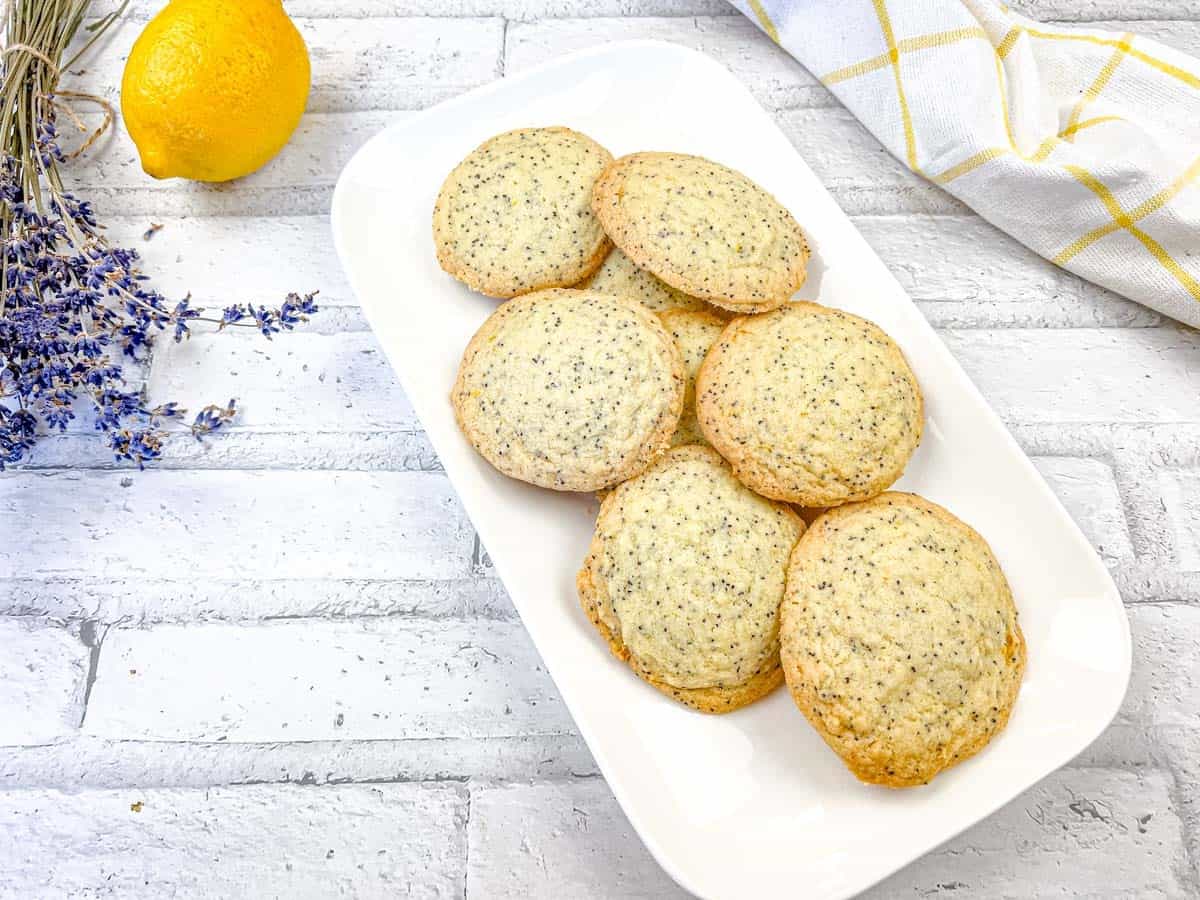 A top-down shot of Lemon Poppy Seed Cookies on a white plate.
