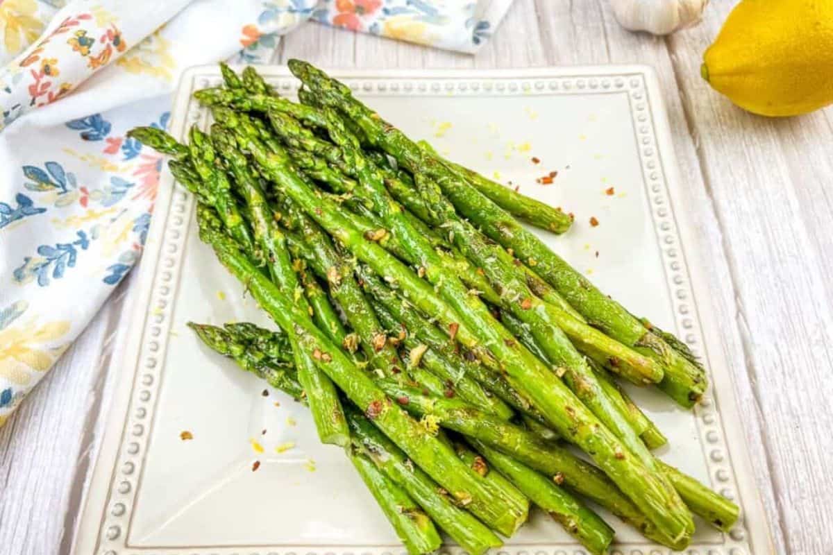 Grilled Asparagus on a white square plate.