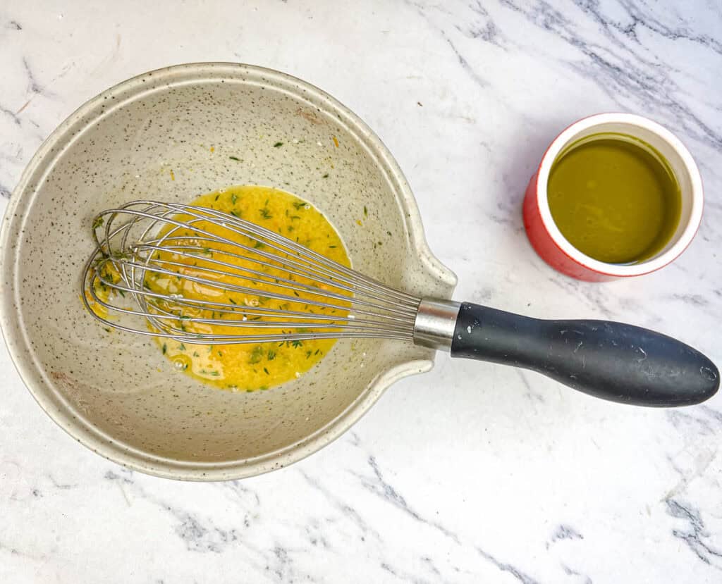 Whisk orange juice, lemon juice, mustard powder, honey, orange zest, and salt in a small bowl.