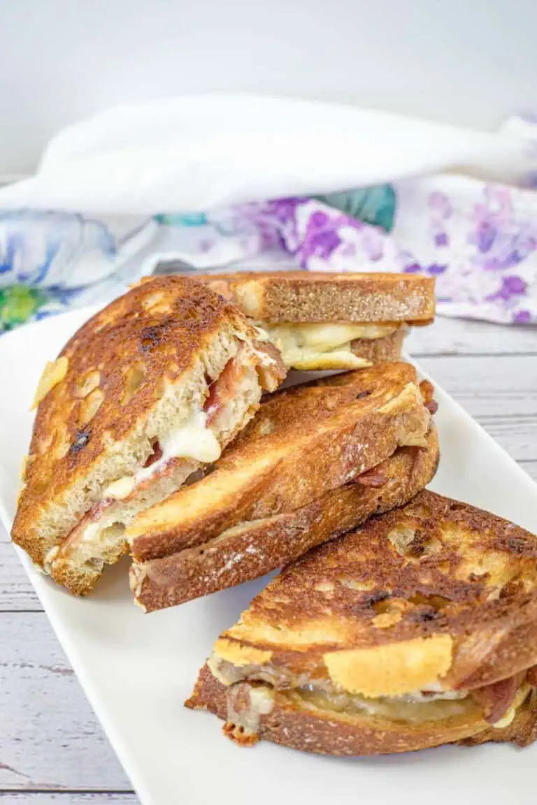 Bacon Grilled Cheese Sandwiches with Hot Honey Butter on a white plate.