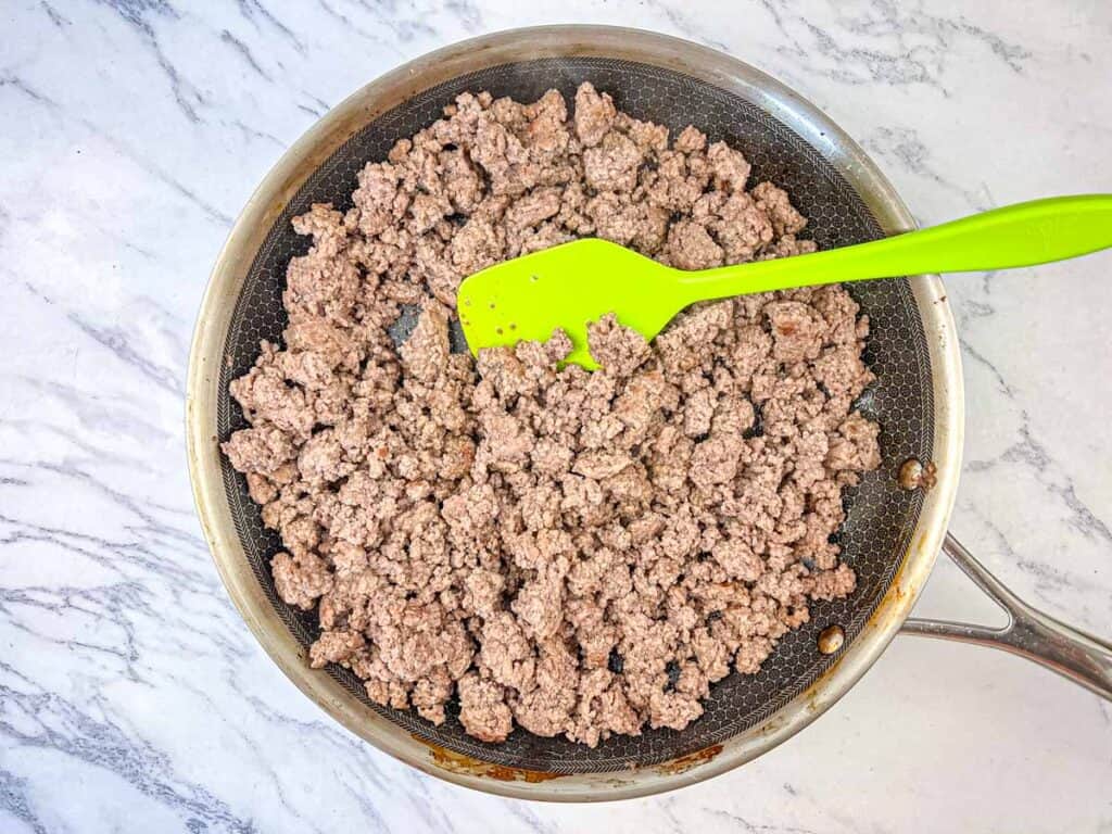 Cook ground beef with steak spice until browned.