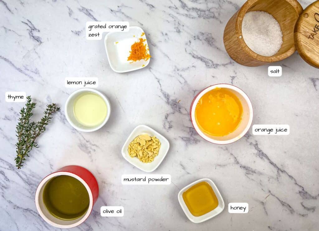 Salmon bowl citrus dressing ingredients with labels.