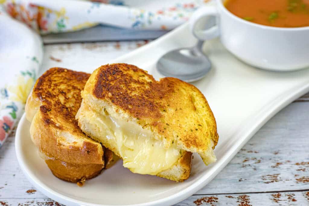 Garlic Bread Grilled Cheese on a white plate.
