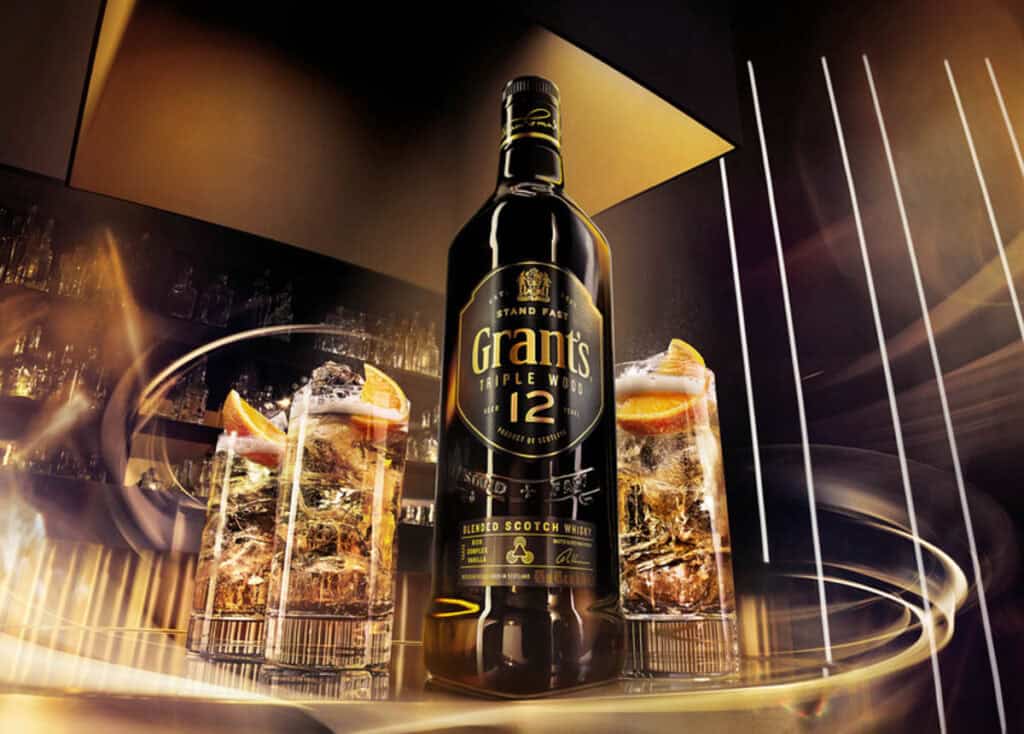 A bottle of Grant's with a glasses on a background.