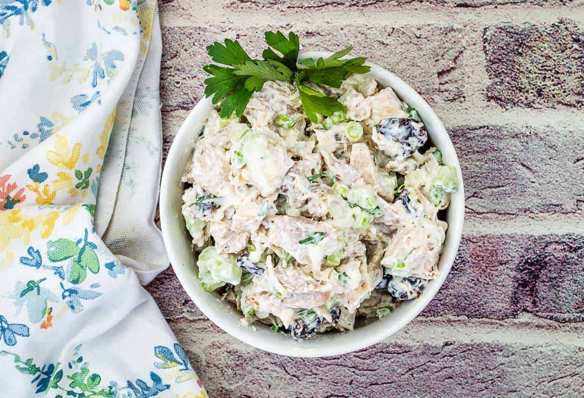 Top-down shot of Turkey Salad with Cranberries & Walnuts on a bowl.