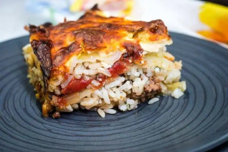 A square portion of Cabbage Roll Casserole on a black plate.