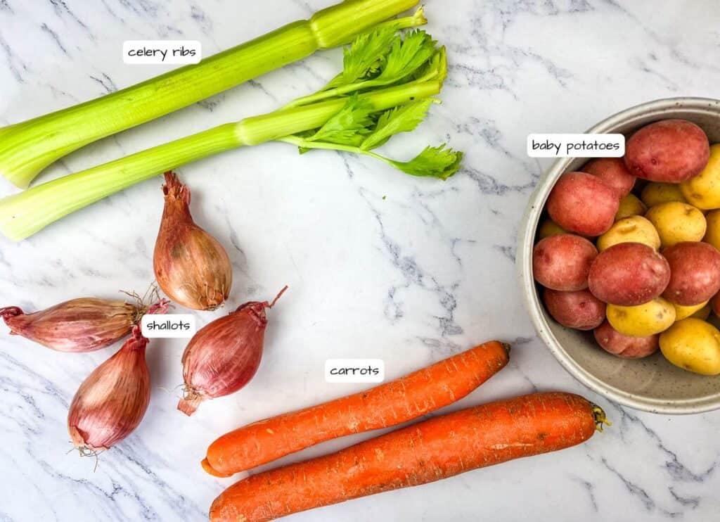 Slow Cooker Herb-Crusted Pork Roast vegetables ingredients with labels.