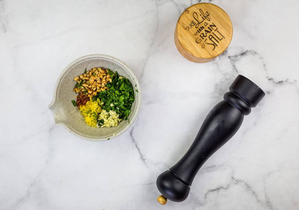 Prepare the gremolata and mix well.