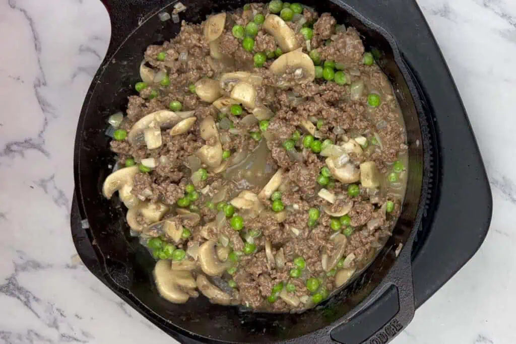 Fold in the frozen peas.