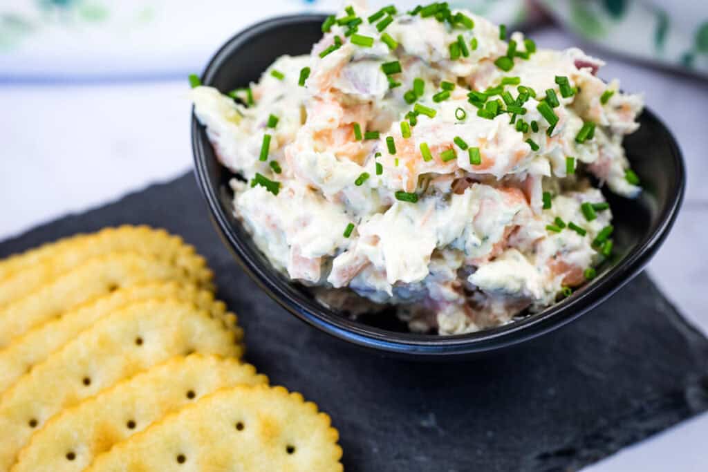 Smoked Salmon Tartine on a black bowl.