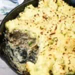 A Skillet Stroganoff Pie with a small portion missing.