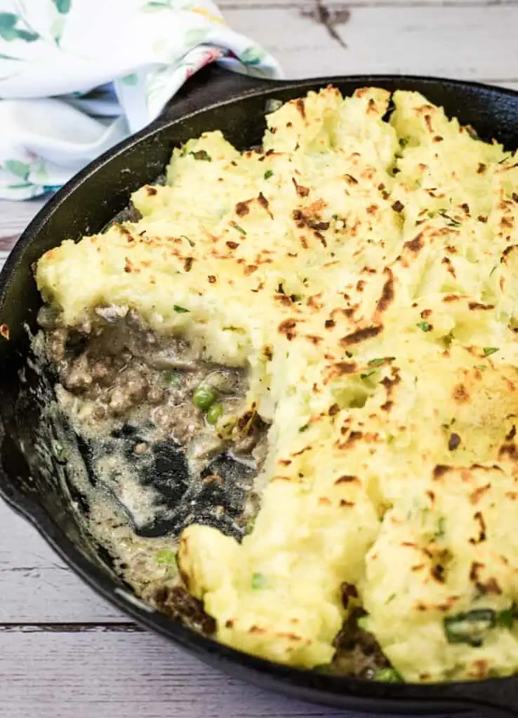 A Skillet Stroganoff Pie with a small portion missing.
