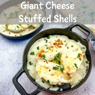 A horizontal shot of 2 individual sized servings of Cheese Stuffed Pasta Shells.