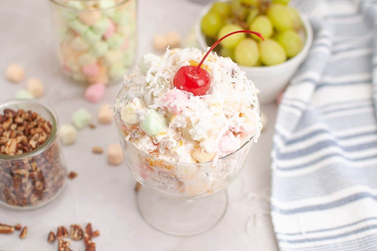 A colorful Ambrosia Salad beautifully arranged in a serving bowl.