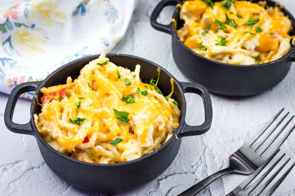A 2-bowl serving of chicken spaghetti.