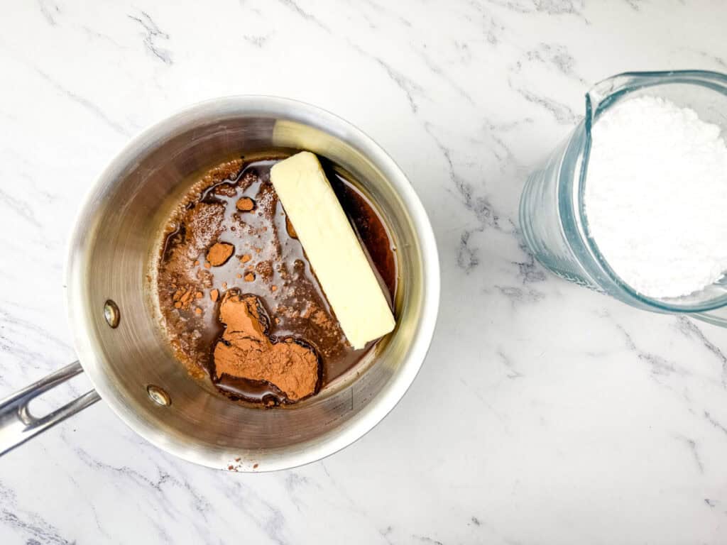 Stir together the butter, Coca-Cola soda, and cocoa powder.