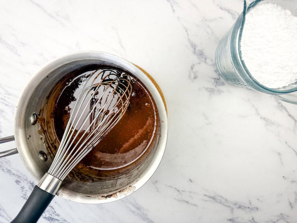 Whisk in the powdered sugar.