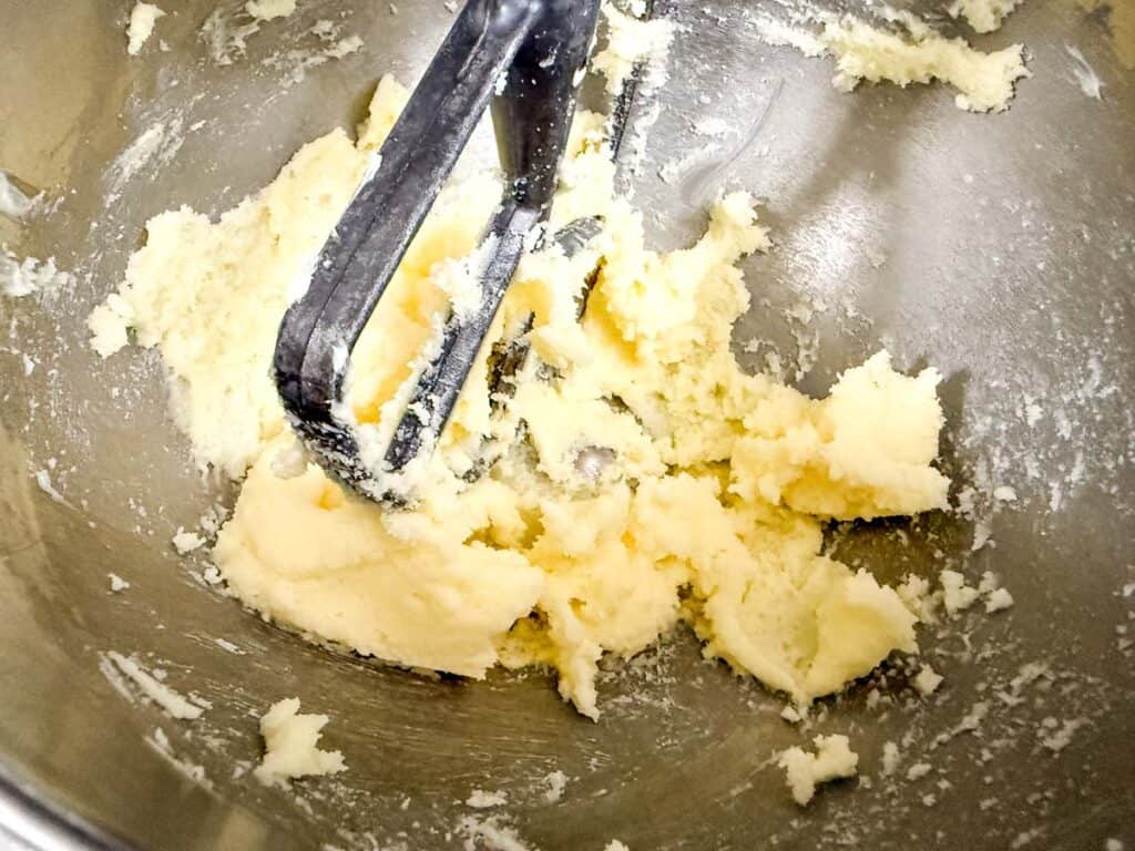 Beat the butter and sugar.