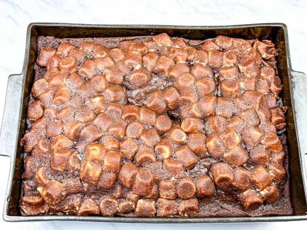 Cool the cake in the pan before frosting.