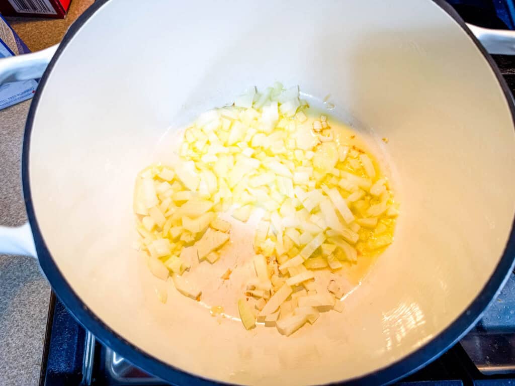 Stir in the minced garlic, dried oregano, dried basil, and red pepper flakes.